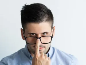 Glasses slipping down face during work illustrating practical benefits of LASIK Sydney for active professionals