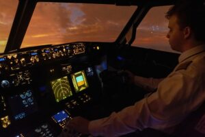 Pilot in cockpit scanning between flight instruments and outside horizon, highlighting need for stable vision and laser vision correction.