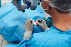 Surgeon performing procedure illustrating precision vision required for LASIK Sydney candidates in healthcare